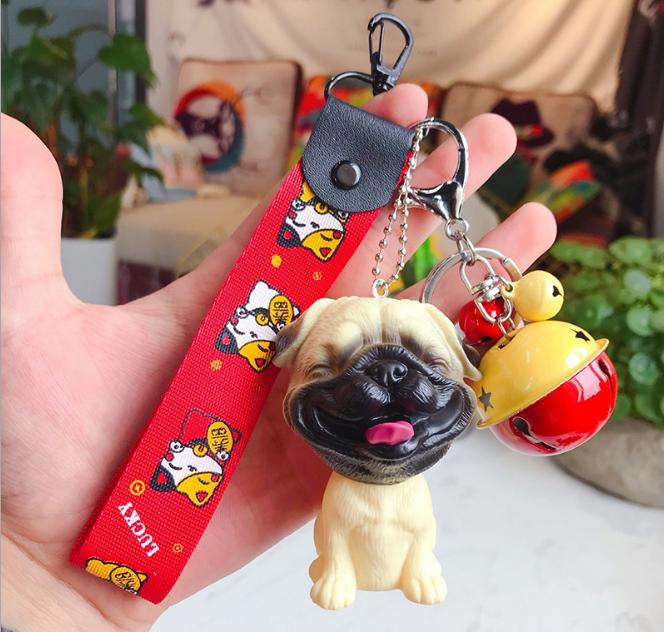 Móc khóa chó vàng mặt xệ kèm dây đỏ và chuông đỏ vàng Cute