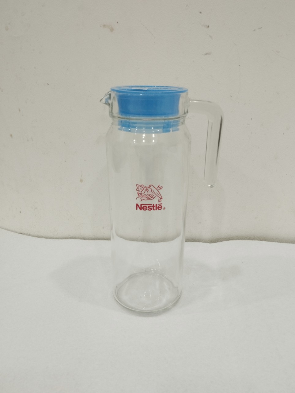 bình thủy tinh đựng nước 1.1L quai cầm miệng rót hoa văn trơn