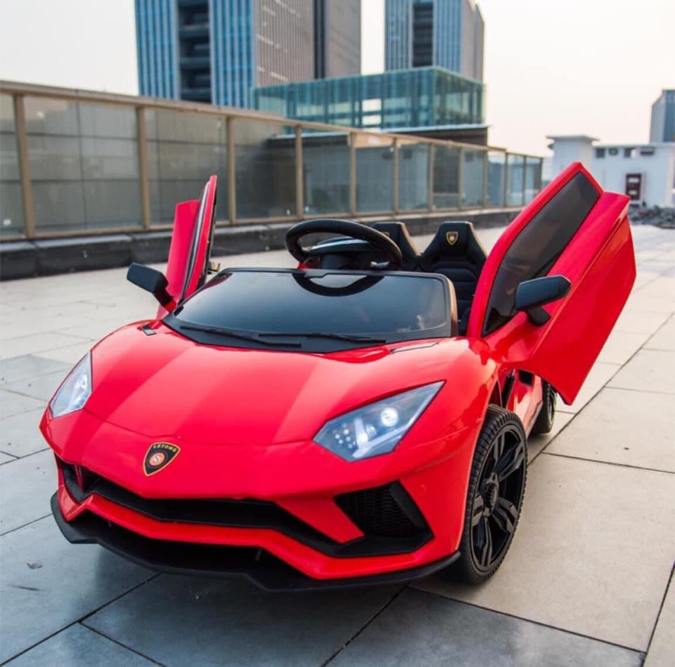 Ô tô xe điện đồ chơi Lamboghini LT998 cho bé 2 chỗ 2 động cơ kèm nhún cánh mở chéo (Đỏ-Cam-Trắng)