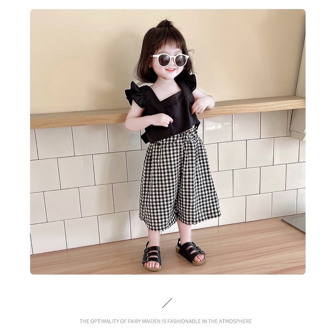 Siêu phẩm áo đũi nơ lưng kèm quần caro cho bé gái