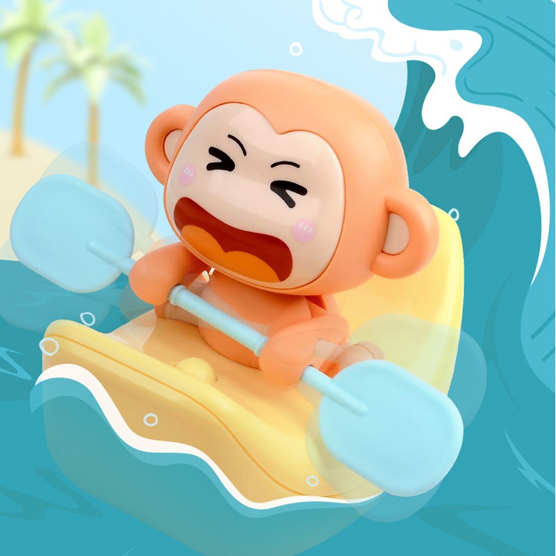 Đồ chơi thả bồn tắm khỉ con chèo thuyền chuối điện