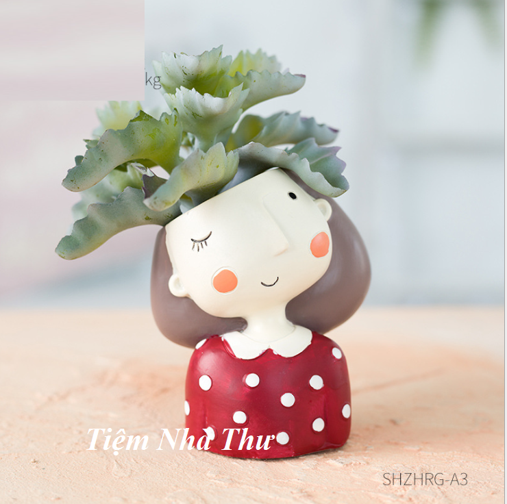 Chậu trồng cây hình bé gái chấm bi đỏ đáng yêu