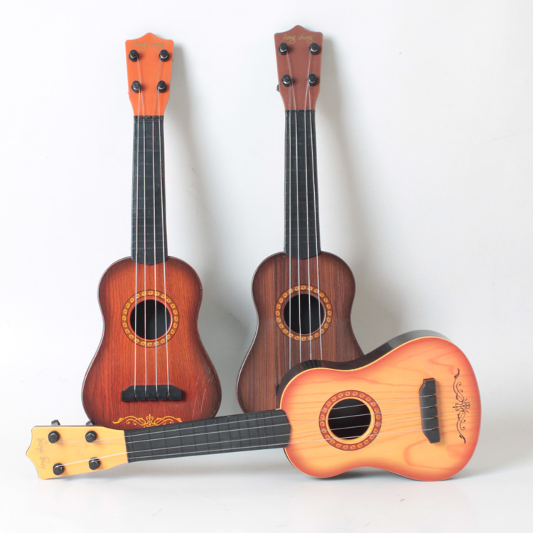 Đàn Ukulele Nhỏ Đàn Guitar Mini 4 Dây Có Thể Chơi Giáo Dục Sớm Đồ Chơi Âm Nhạc - Đàn Ghita cho bé (nhựa, màu giả gỗ) + Tặng kèm 2 kệp chống muỗi cao cấp ( hàng mới đang hót )