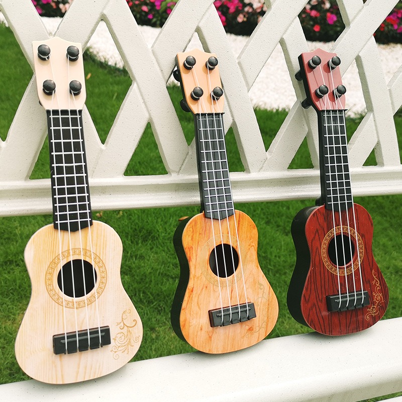 Đàn Ghita Nhựa Cho Bé Đàn Ukulele Mini Giả Gỗ, Đàn ukulele nhựa giả gỗ cực đáng yêu cho bé, Ukulele Người Mới Bắt Đầu Đàn Guitar Nhỏ Giáo Dục Sớm Học Tập Đồ Chơi Nhạc Cụ Ukulele