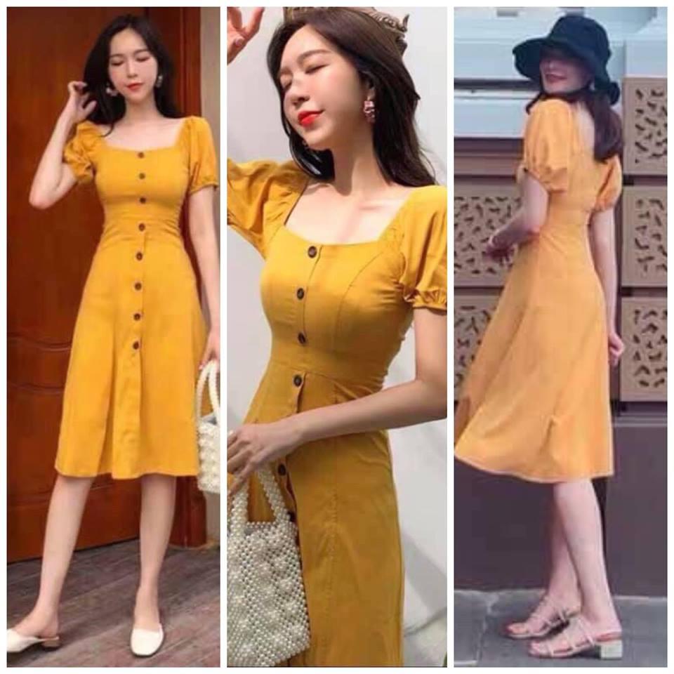 Đầm vàng cổ vuông nút đen