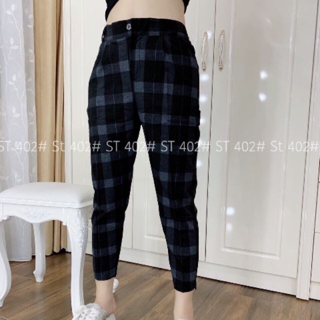 Quần kẻ caro chất đũi mềm mại.