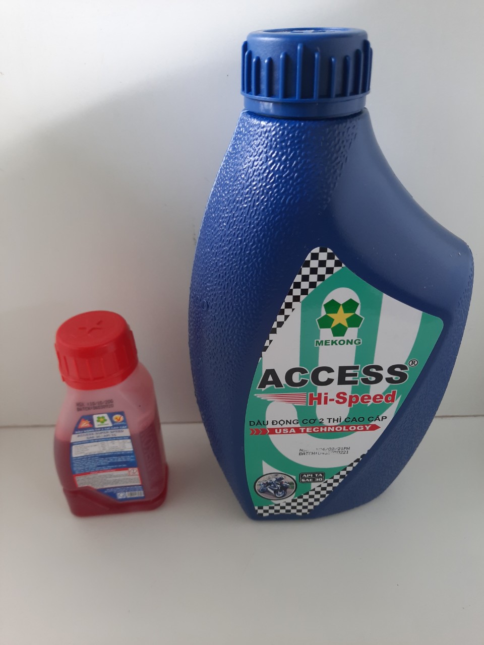 Combo : Dầu nhớt 2 thì Access his speed - nhớt màu xanh- chai 1l + 1 chai tc 100ml