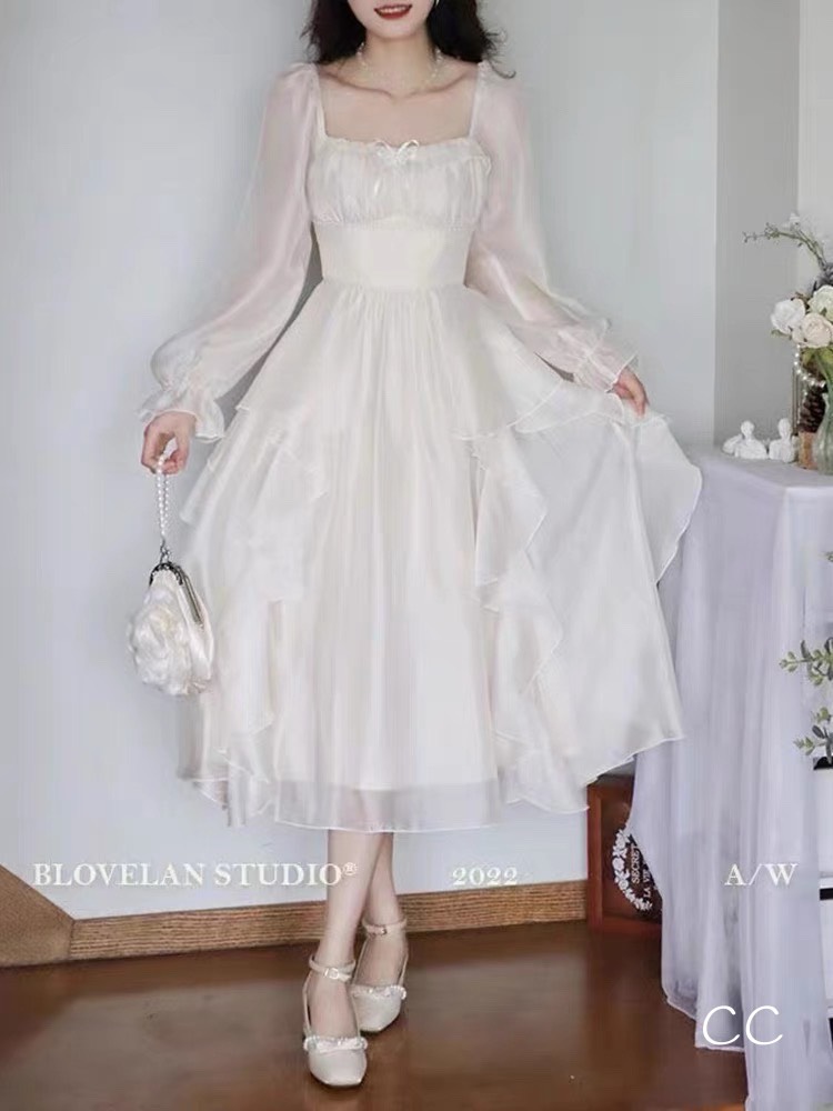 Đầm midi trắng nhún ngực đính cườm bo eo phối bèo