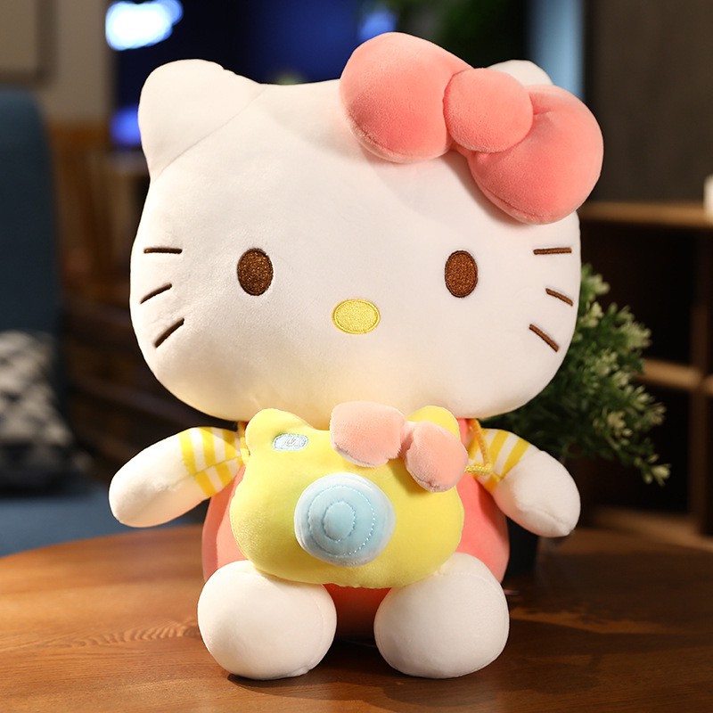 Gấu bông kitty đeo máy ảnh - mèo kitty bông cho bé - gấu bông mina