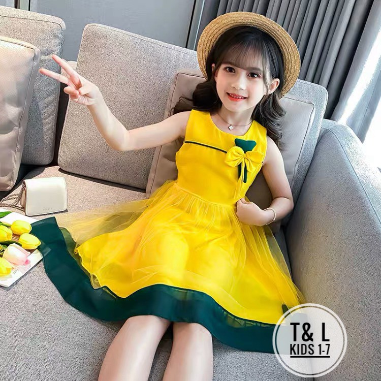 Váy đủi đính nơ 2 màu vàng và hồng