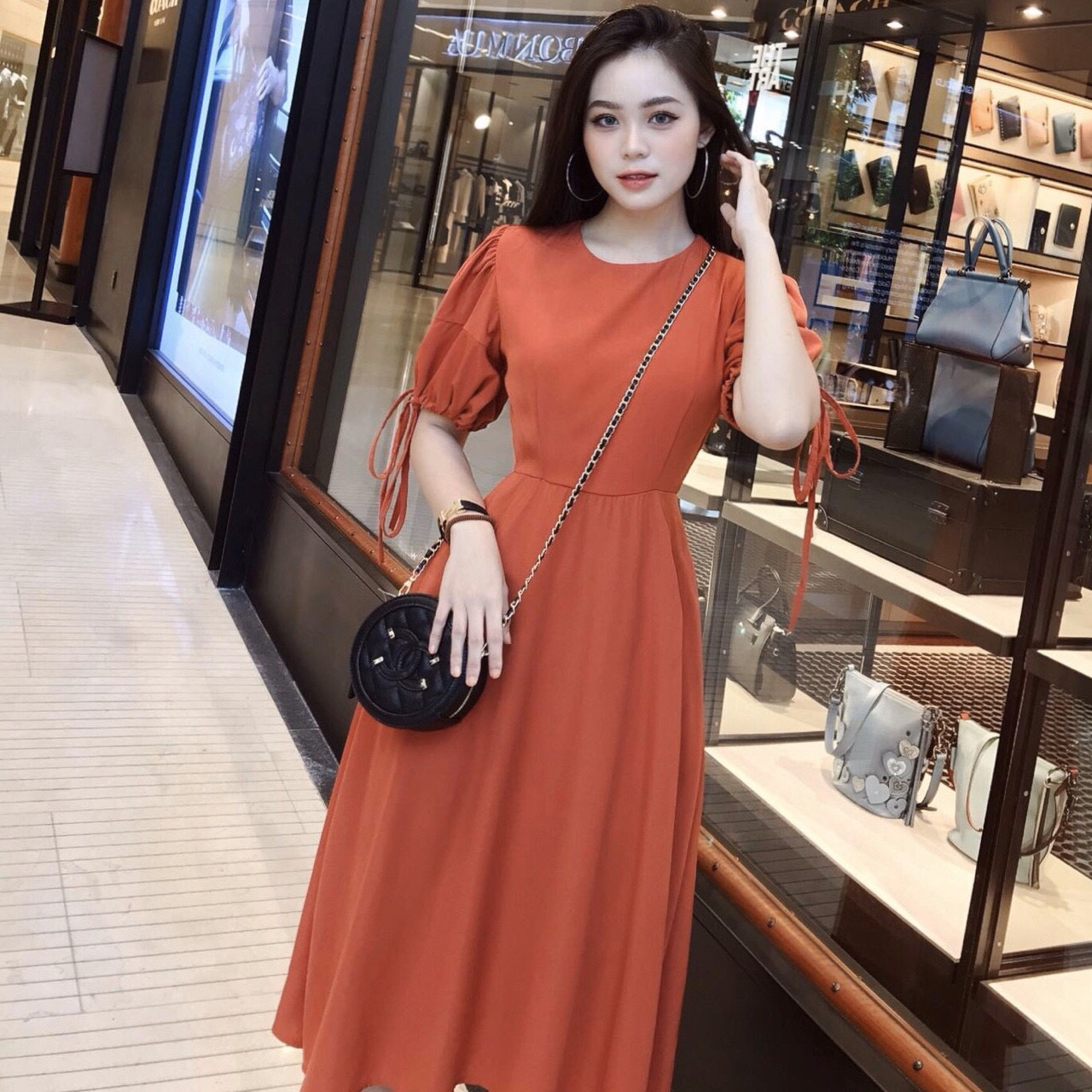 Đầm xòe midi cam tay phồng nơ tay - dx945