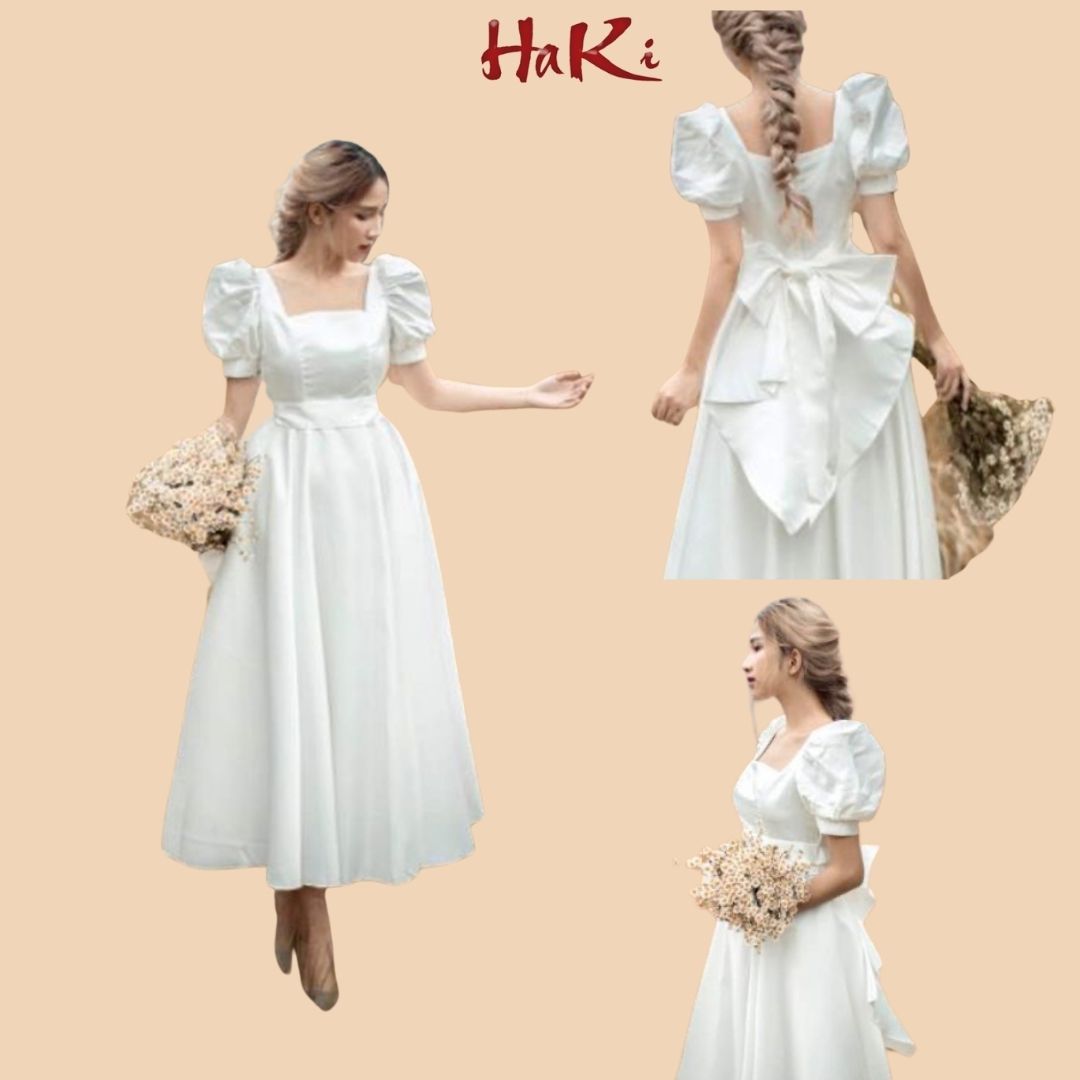 Đầm váy nữ dự tiệc maxi Trắng cổ vuông tay ngắn có nơ sau phong cách thời trang HAKI MSP012 chất Lụa mango có lót trong.