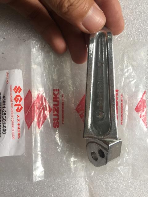 Cục nhôm gác chân sau bên trái Suzuki Raider/ Satria Fi, sản xuất tại Indonesia, bao bì đóng gói niêm phong hãng
