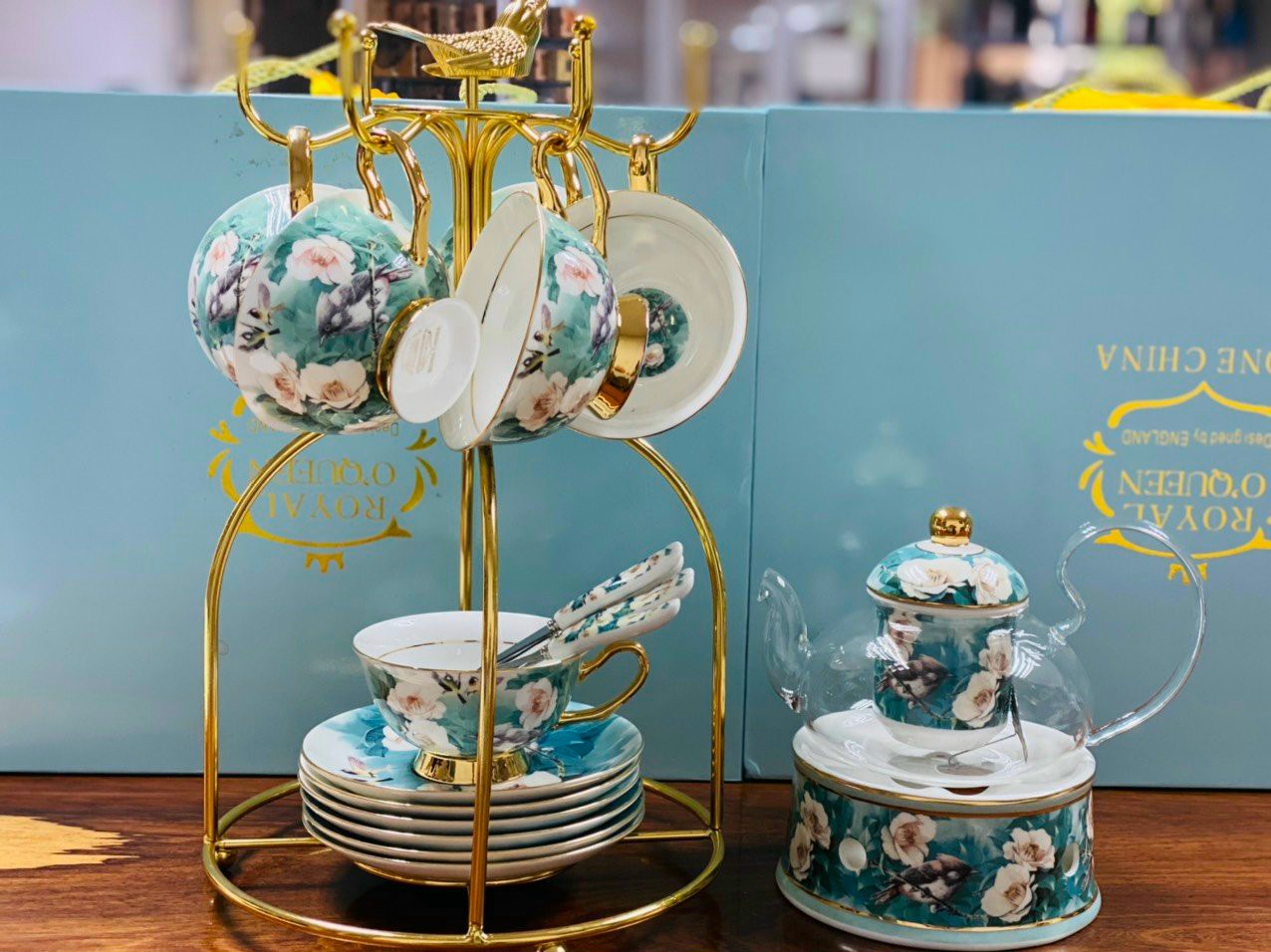 Bộ ấm chén sứ xương kèm lót tách + bếp châm trà chim hoa xanh viền vàng