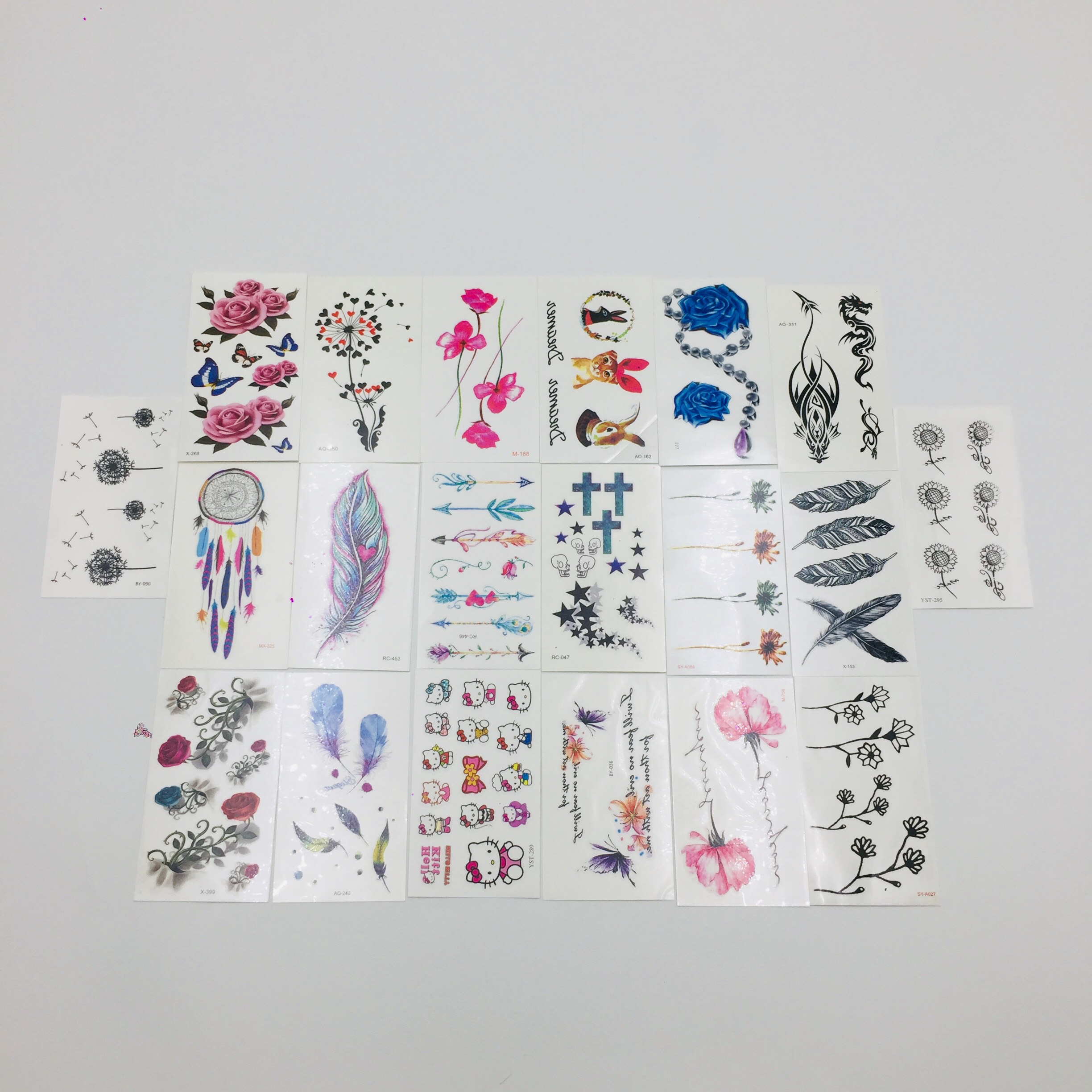 Combo 20 tấm xăm dán mini tha thu đẹp gồm rồng, thánh giá, bông hoa hồng xan, hoa hướng dướng trắng đen, hoa nhỏ, mũi tên , con mèo, lông vũ, hoa hồng đỏ, hoa bồ công anh,....