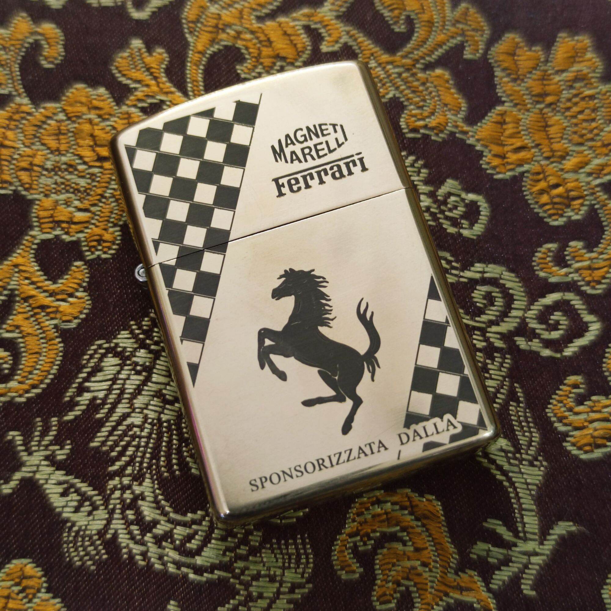 Bật lửa zippo đồng nguyên khối mẫu ferrari tặng kèm đá bấc, chai xăng nhỏ).