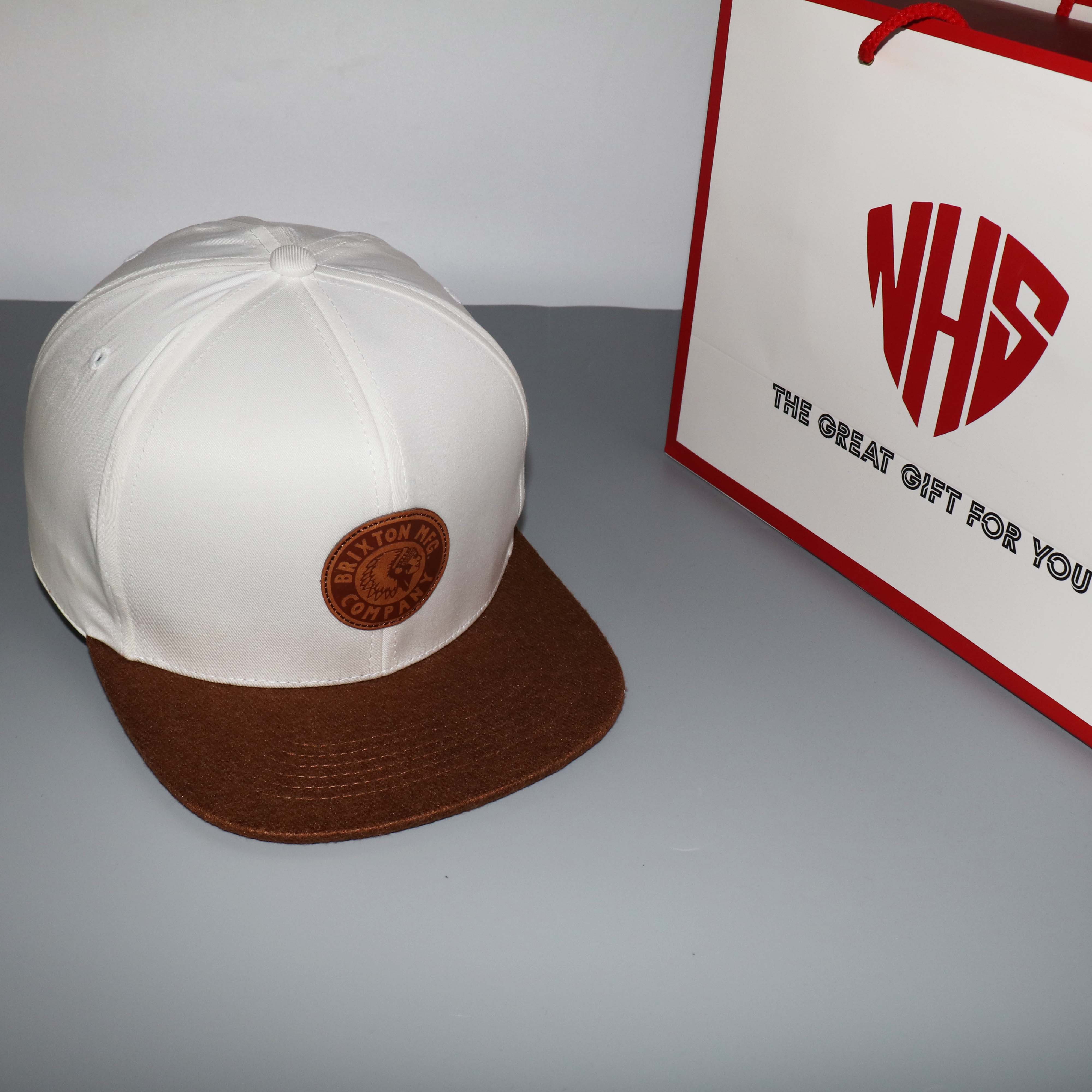 Nón Snapback NHS BRTD2 Brixton trắng kết nâu logo thổ dân.