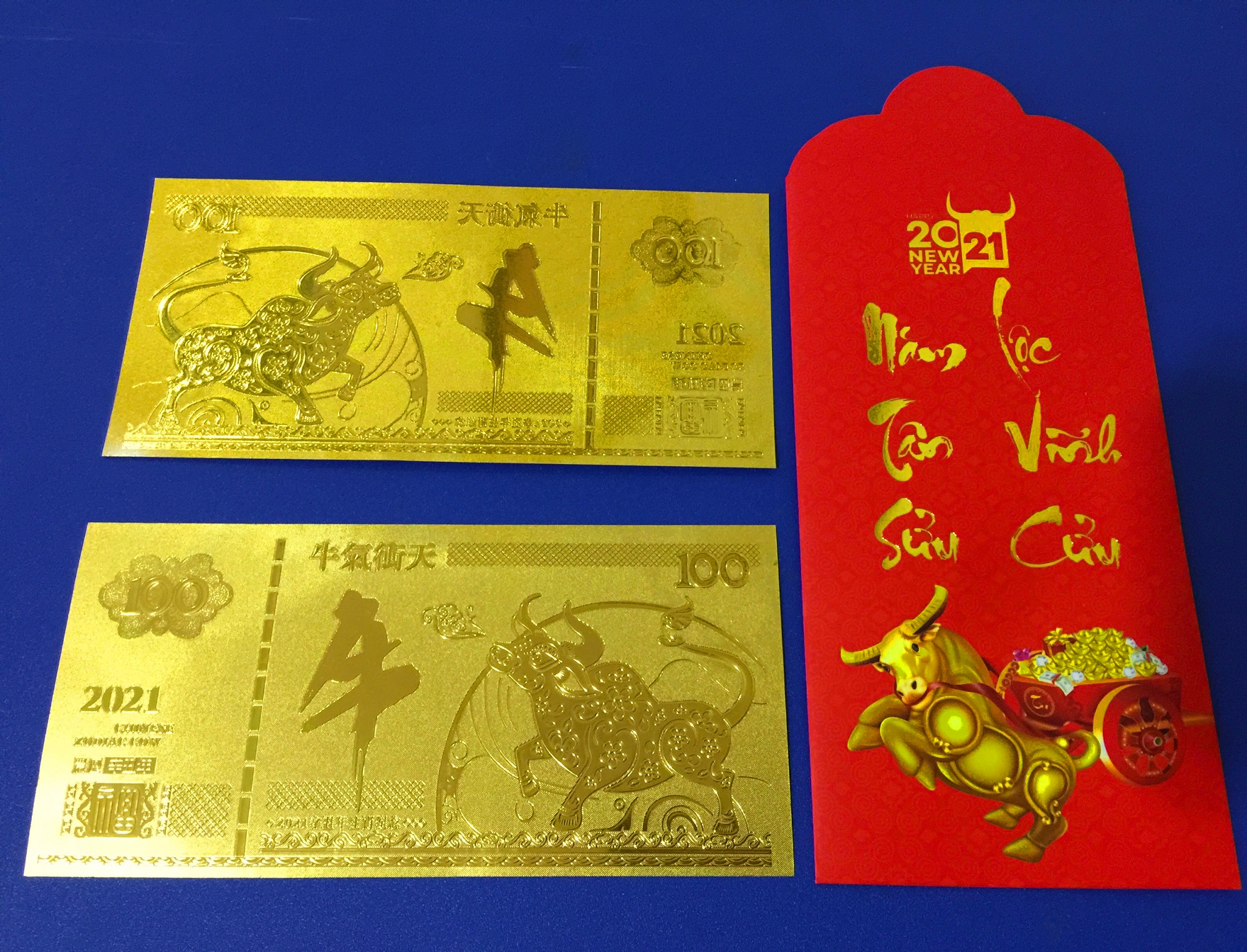 TỜ CON TRÂU MẠ VÀNG PLASTIC KÈM TẶNG BAO LÌ XÌ TẾT 2021