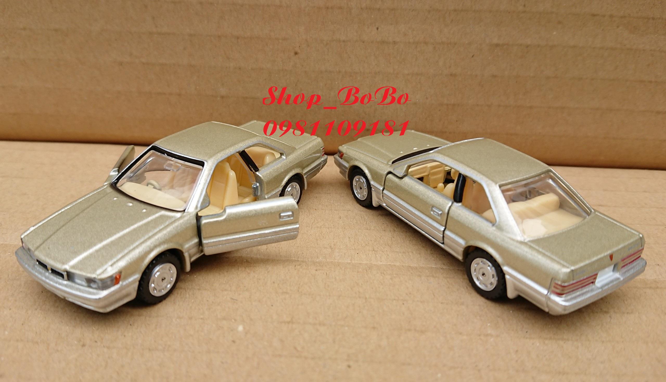 Xe mô hình Tomica Nissan Leopard màu vàng nhạt mở được cửa