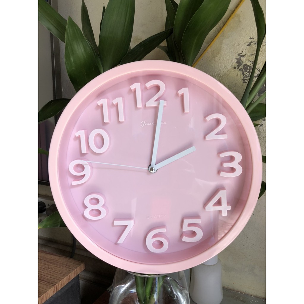 Đồng hồ treo tường kim trôi QUARTZ.