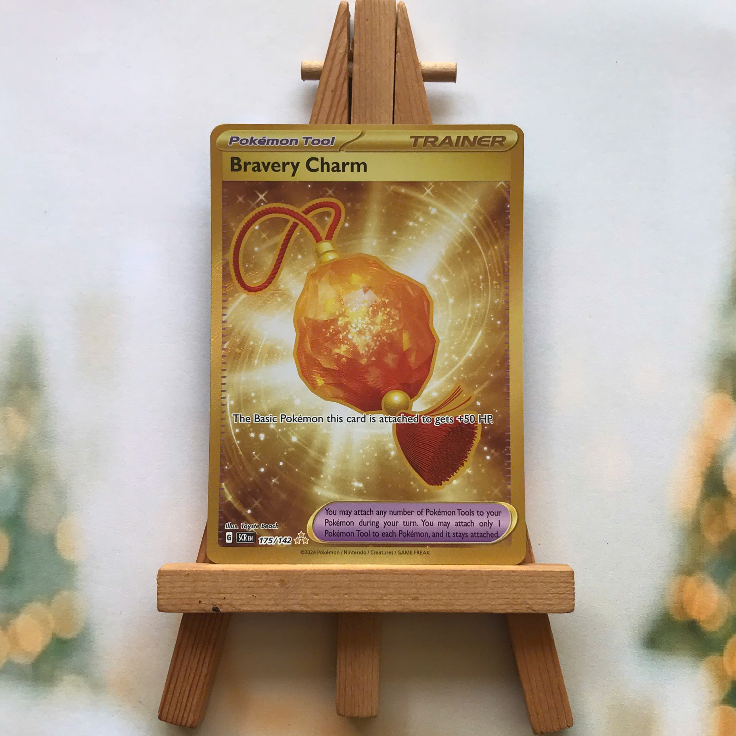 big charm gold card pokemon price Attach a Pokemon Tool to 1 of your Pokemon that doesnt already have a Pokemon Tool attached to it Bravery Charm Full Art Gold