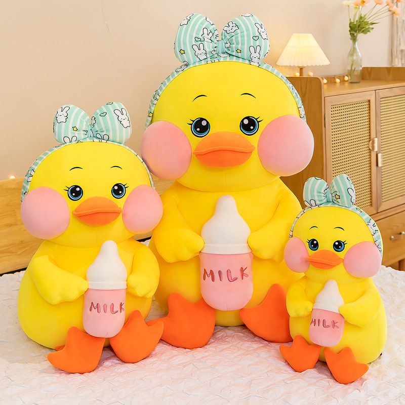 Vịt ôm bình sữa, vịt gấu bông có nơ, vị má hồng, gấu bông to