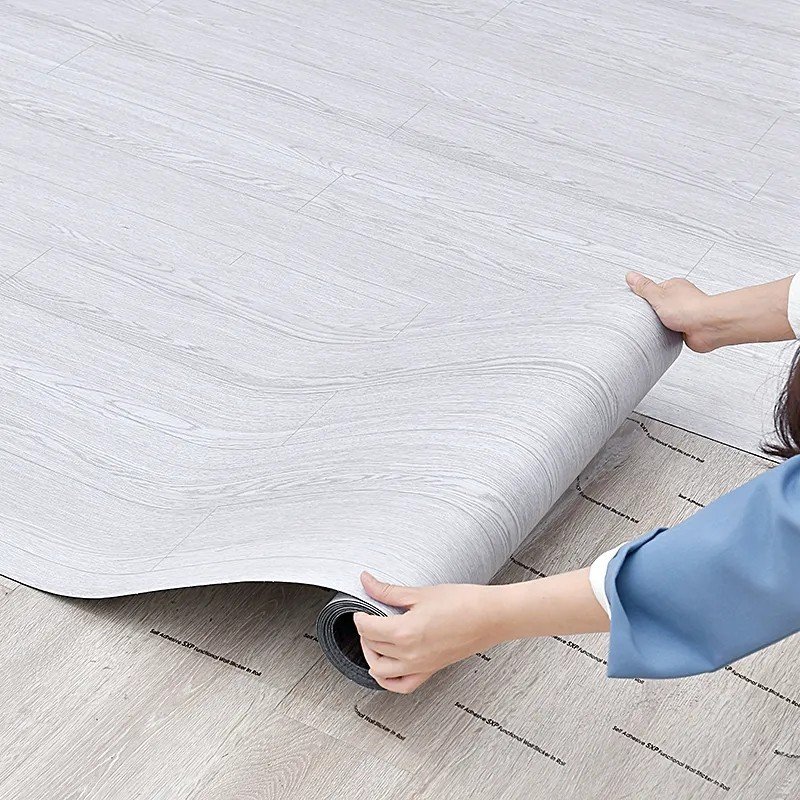 Tấm dán nhựa giả gỗ keo sẵn dán tường và sàn nhà