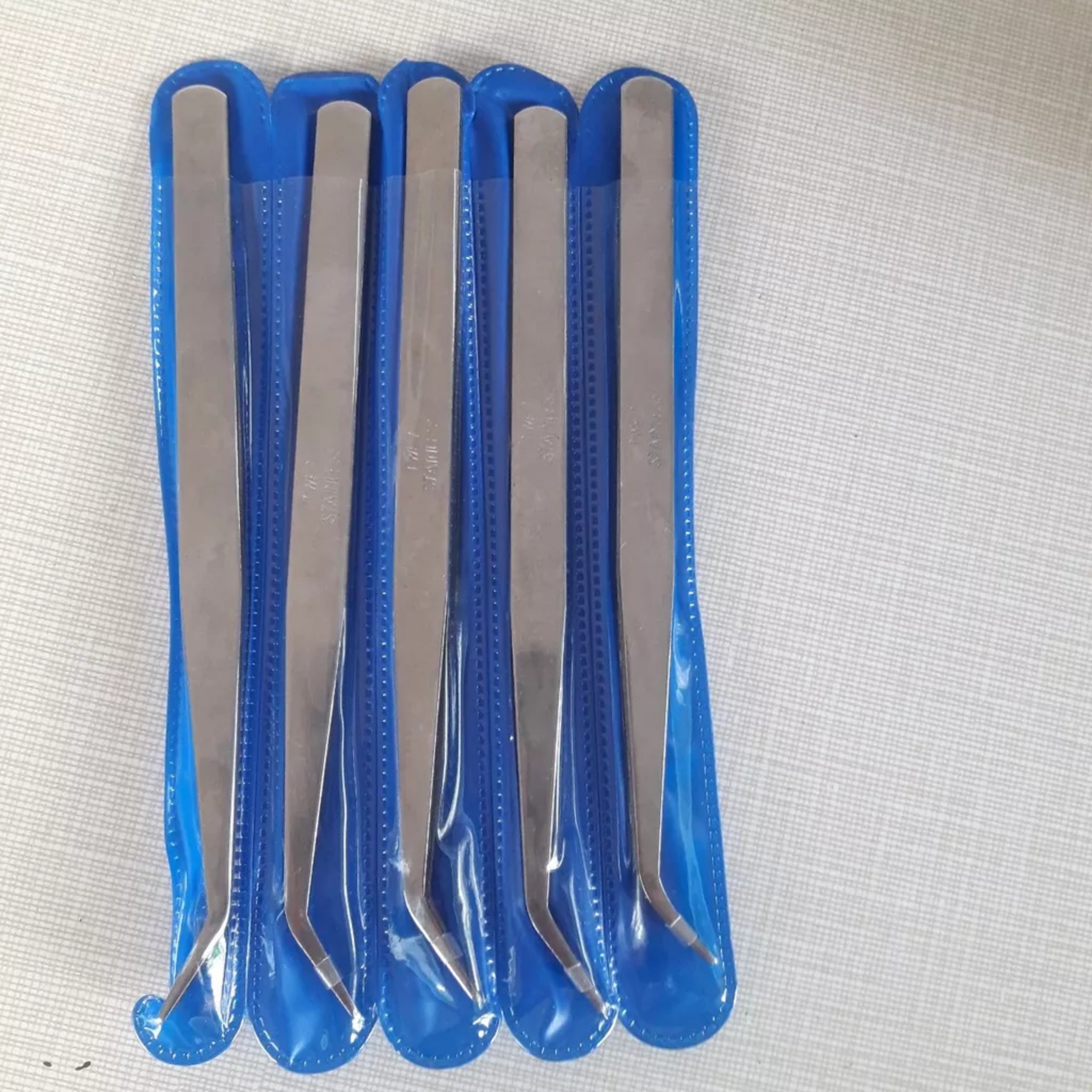 Nhíp sỏ chỉ máy vắt sổ, máy viền, máy nhiều kim...